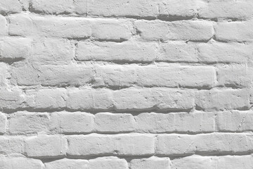 The white grunge brick wall texture or background