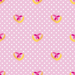 Seamless vector pattern two gold rings on a pink polka dot background.