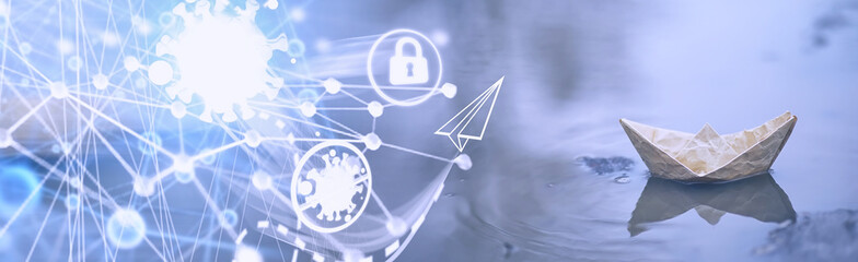 Paper boat in the water on the street. The concept of early spring. Melting snow and an origami boat on water waves.