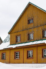 Fototapeta na wymiar View of the cottage in winter