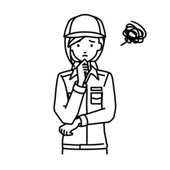 立って手をあごにあてて困っている作業員の女性