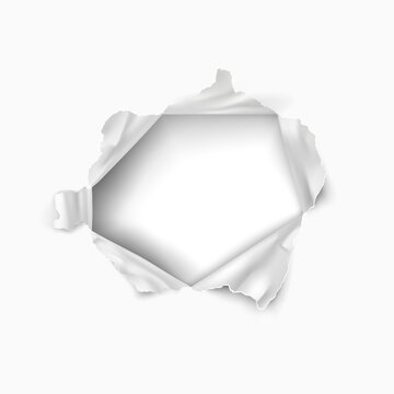 Torn hole in the sheet of paper. Paper frame.