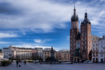 Fototapeta na wymiar Market Square in Krakow. To the right - the Basilica of St. Mary
