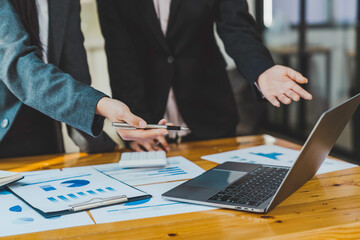 Business team discussing financial report professionals having a meeting. The diverse group of coworkers discusses new decisions, Creative meetings,s and workplaces, business, finance, teamwork.