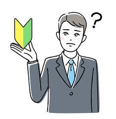 初心者マークを持って悩むビジネスマン