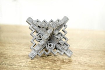 Gray abstract models detail printed on 3d printer from powder close-up. 3D prototype created by...