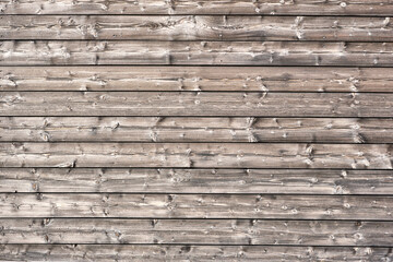 Background from a wall made of horizontal wooden planks