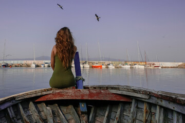 Fototapeta na wymiar a woman enjoying the sea