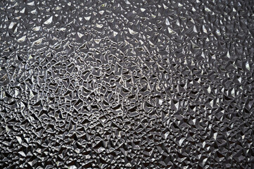 water drops on a glass, glass in the form of water droplets illuminated by sunlight, background