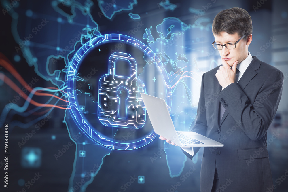 Poster attractive businessman using laptop with abstract digital padlock and map hologram on blurry office 