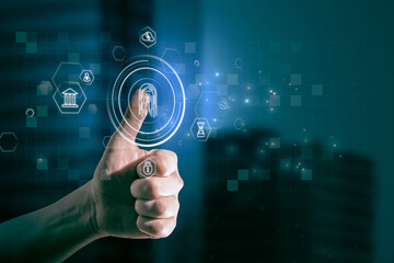 Close up of businessman thumb pointing at abstract glowing id fingerprint web protection and security interface on blurry blue bokeh city background. Identification