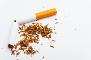 31 May of World No Tobacco Day, no smoking, close up of broken pile cigarette or tobacco STOP symbolic on white background with copy space, and Warning lung health concept