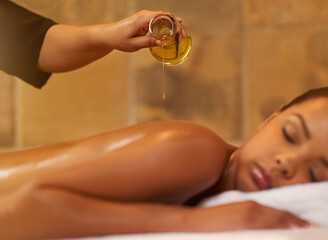 Enjoy some you time. Cropped shot of a young woman getting a massage at the spa.