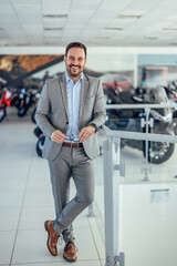 Portrait of a smiling businessman, standing, posing for the pict
