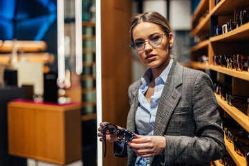 Serious girl, looking at the camera, while searching for the new