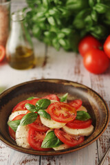 A bowl with traditional Italian caprese salad
