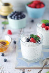 Greek yogurt in glasses with berries and quinoa