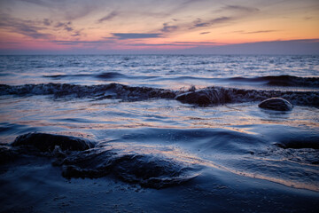 Fototapeta na wymiar rocks in the sea at sunset