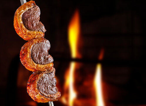 Steak rotisserie at the steakhouse, sliced picanha, Picanha