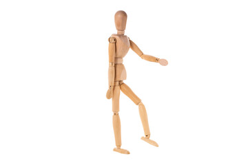 wooden man stands with one arm and leg raised isolated on white background