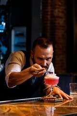 Portrait of expert handsome barman.