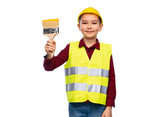 building, construction and profession concept - little boy in protective helmet and safety vest with brush over white background