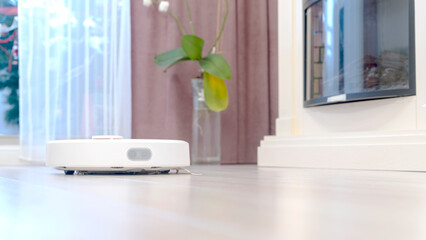 Robot wireless vacuum cleaner working on the floor