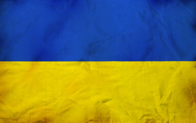 Fabric curved flag of Ukraine, UA. Blue and yellow colors. Close up shot, background.