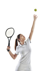 Keep calm and serve an ace. Studio shot of a female tennis player getting ready to serve the ball. © STEEX/peopleimages.com