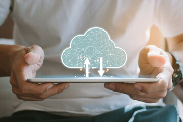 Cloud computing concept - connect devices to cloud. Young man or information technologist with cloud computing icon and tablet.