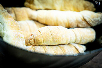 Fresh tasty sausage rolls on plate. Sausage rolls street food. Oven baked sausage snacks