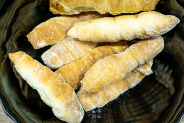 Fresh tasty sausage rolls on plate. Sausage rolls street food. Oven baked sausage snacks