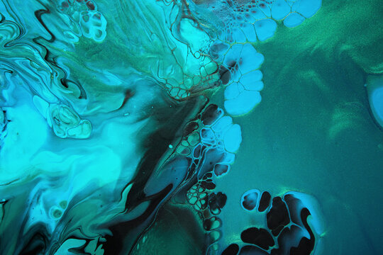 Fluid Art. Metallic Green and blue abstract wave swirls on black background. Marble effect background or texture