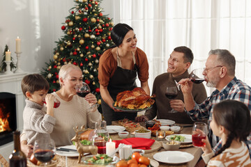 Happy family enjoying festive dinner at home. Christmas celebration