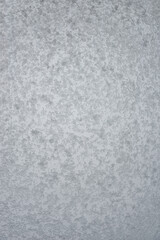 Cover page with wet and snowy with water drops and ice glass window at rainy, stormy and snowy day. Concept of seasonal mood, background with copy space.