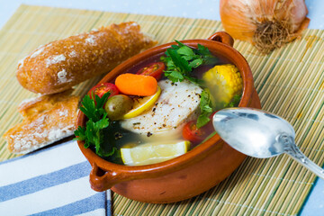 Boil the pollock head for broth. Add potatoes, carrots, shallots, corn and fillets or pollack steak...