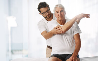 Checking his range of motion. Cropped shot of a young male physiotherapist working with a senior male patient.