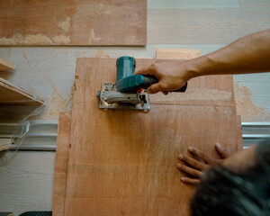 Plywood ,building material. Production of plywood floor. Installation of plywood on the floor.