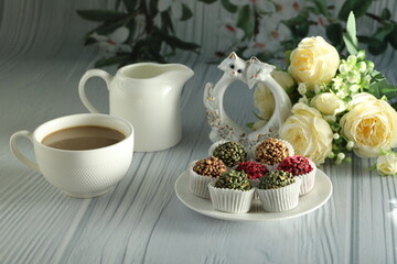 cup of coffee with roses and cake