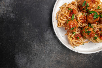 Meatballs served over italian spaghetti pasta with tomato sauce. Italian food. banner, menu, recipe...