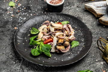 Seafood assorted platter octopus, mussels and shrimps on dark background. Mediterranean food. top view. Food recipe background. Close up