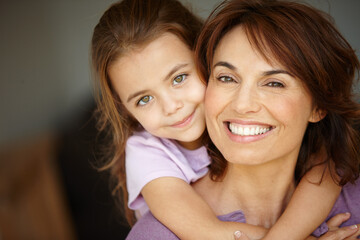 Home is where your mom is. Portrait of a mother spending time with her adorable little girl.