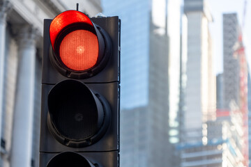 A red traffic light in a large city