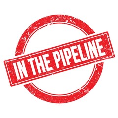 IN THE PIPELINE text on red grungy round stamp.