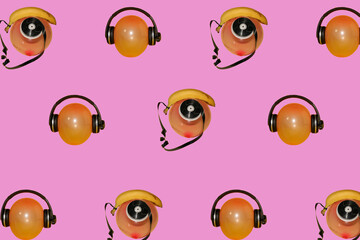 balloon with headphones and retro landline phone made of banana film strip and balloons copied all over pastel pink background creative concept of arranging and merging objects