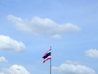 Thailand flag pole with cloud on blue sky background