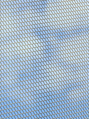 wire mesh of fence with blue sky background