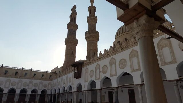 Al-Azhar Mosque, minarets silhouette beautiful archway courtyard, Tilt down. Cairo