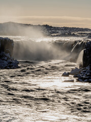 Selfoss waterfall backlit long exposure in Iceland, vertical composition
