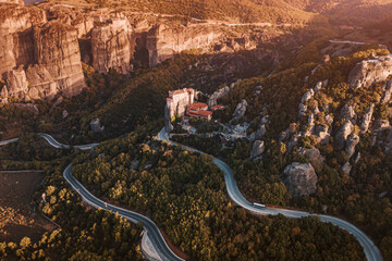 Atmospheric aerial drone view of the famous Monastery of Rousanou Saint Barbaras in Meteora. Tourist and pilgrimage inspirations. Natural and religious wonders of Greece.